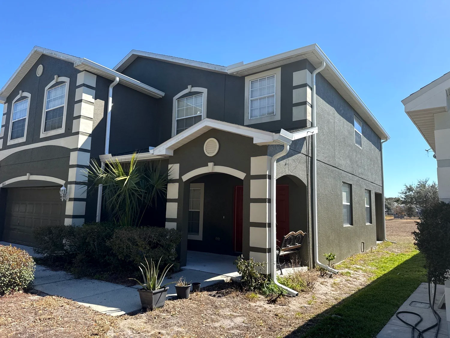 Professional gutter cleaning on a South Florida home