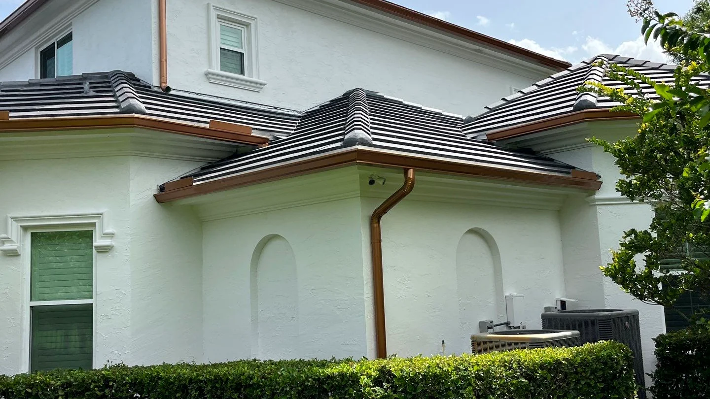 Corner downspout on a coastal home near Lantana