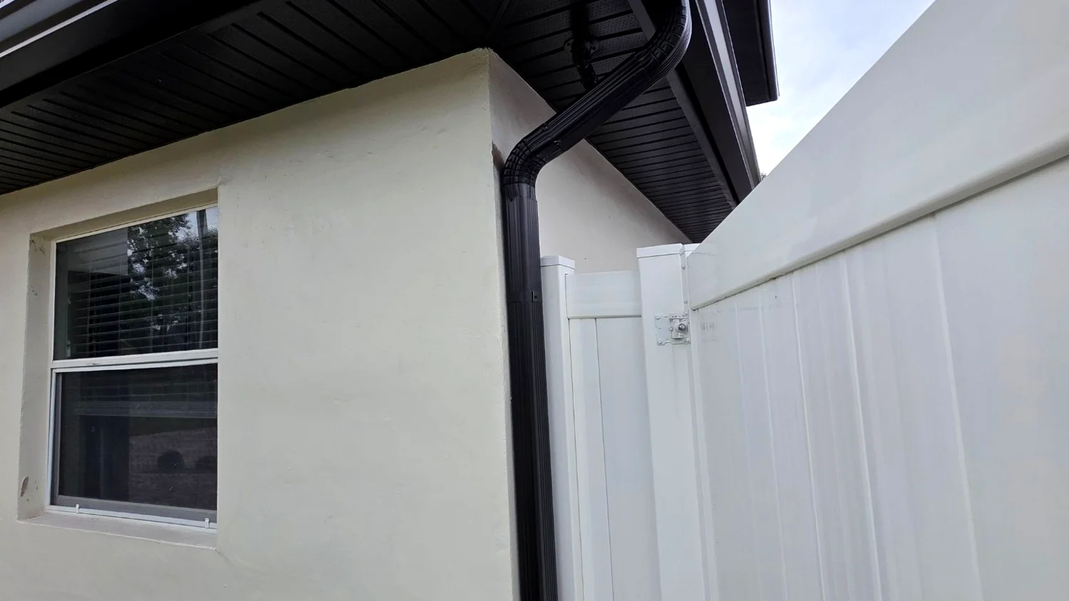 Black gutter downspout installation in Fort Lauderdale