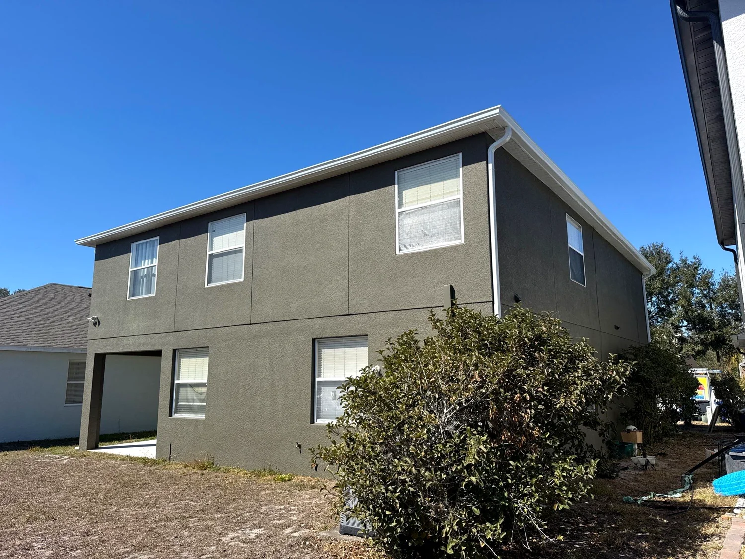Gutter downspout installation and side-yard drainage in South Florida