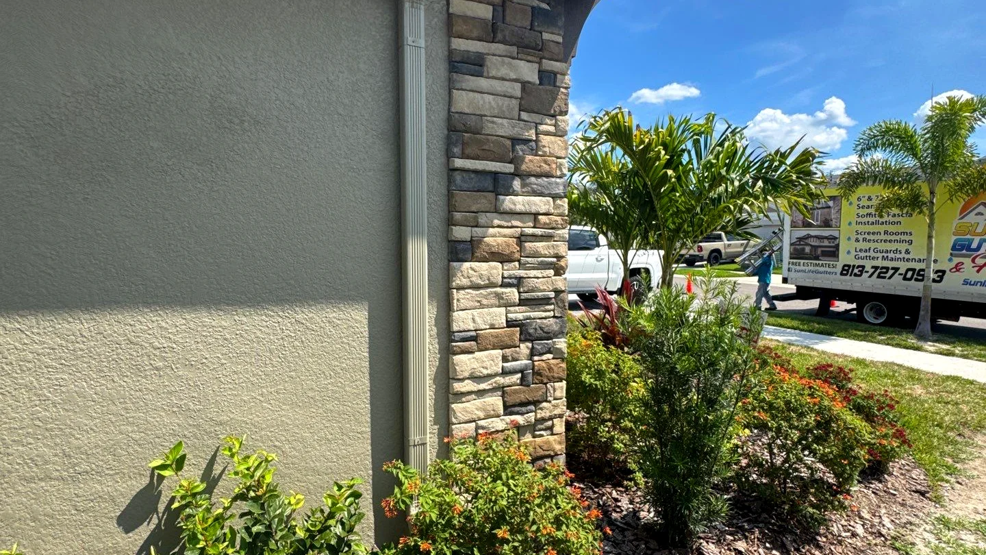 Stone home downspout on a Hollywood, FL property