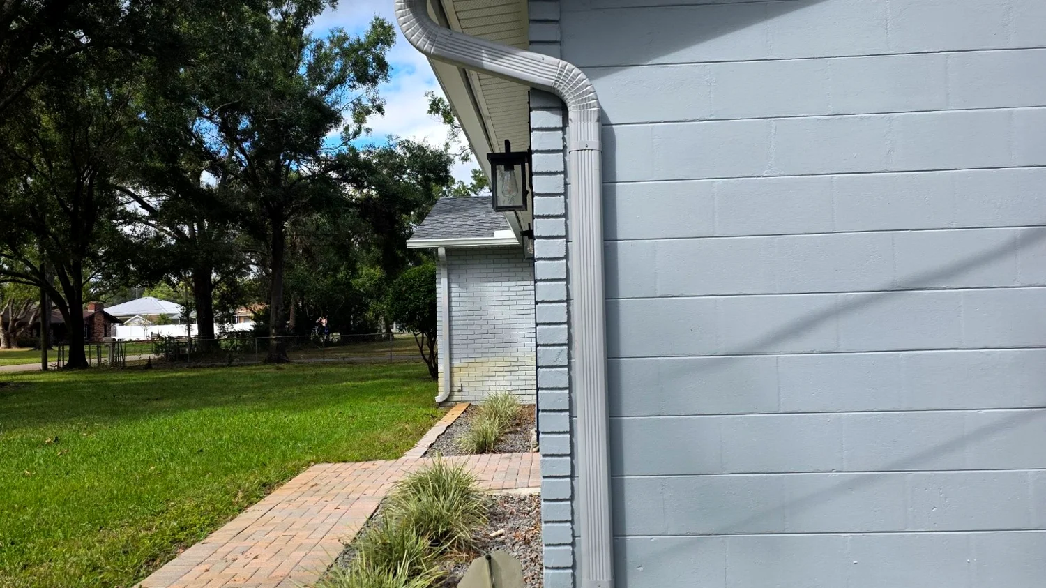 White downspout detail on a Pompano Beach home