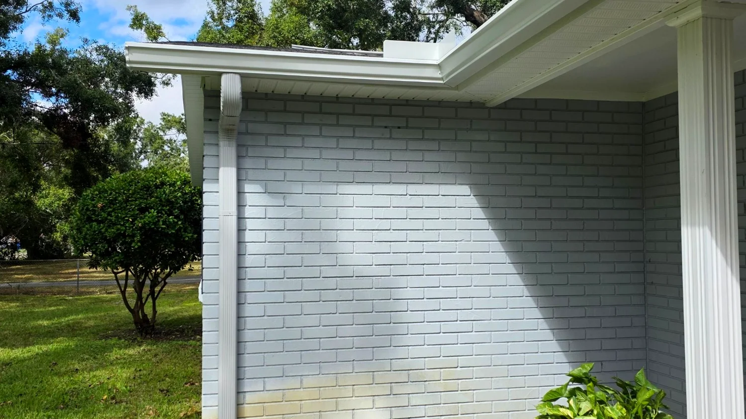 Gutter repair on a brick home in Pompano Beach