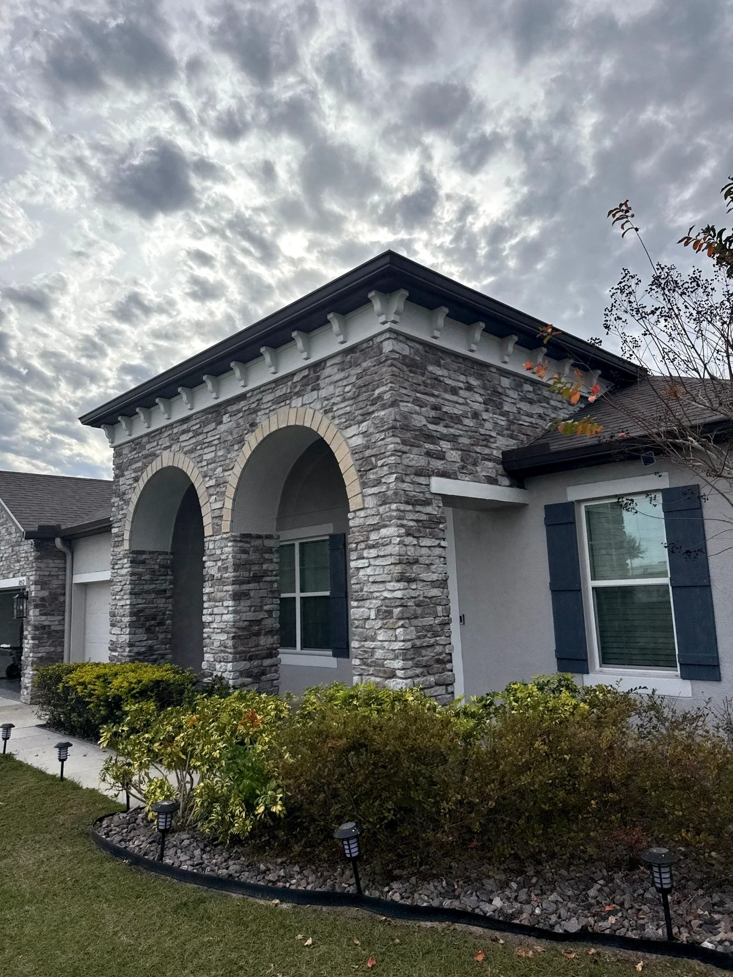 White seamless gutters following the roof edge of a coastal-style home in Apollo Beach