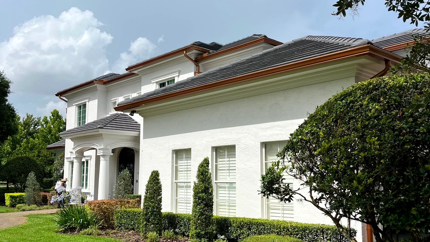 Townhome elevation with continuous gutters tucked behind fascia in Plant City