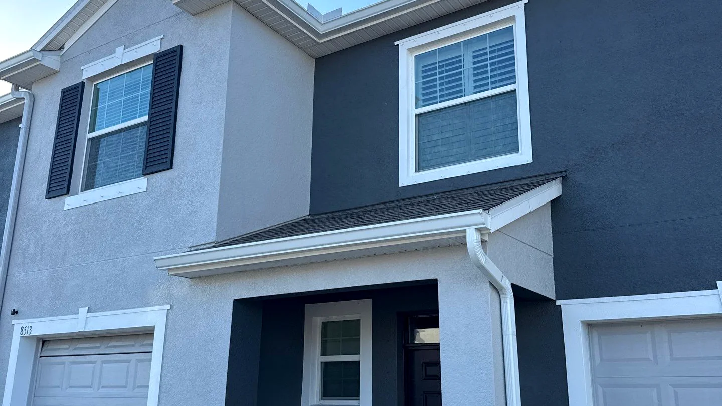 Townhome roofline with refreshed gutters and downspouts in Tampa